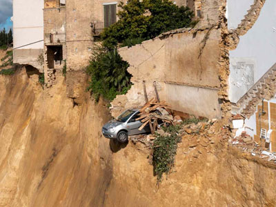 A mile and a half section of cliff collapsed in Sicily after a pounding by Cyclone Harry