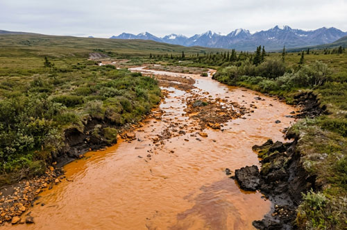 Toxic Arctic rivers turn orange as permafrost releases toxins